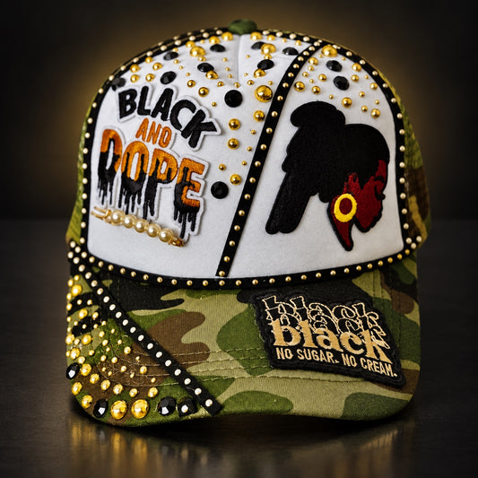 Camo and white Black and Dope statement cap with black and gold embellishments, rhinestones, pearls, and Black woman silhouette