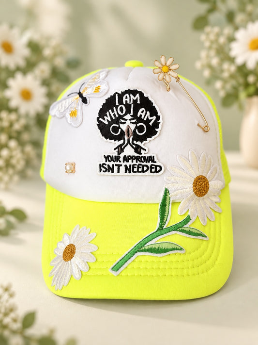 White and neon yellow statement cap with I Am Who I Am Your Approval Isn't Needed patch, daisy appliques, bee detail, pearl accent, and decorative pin