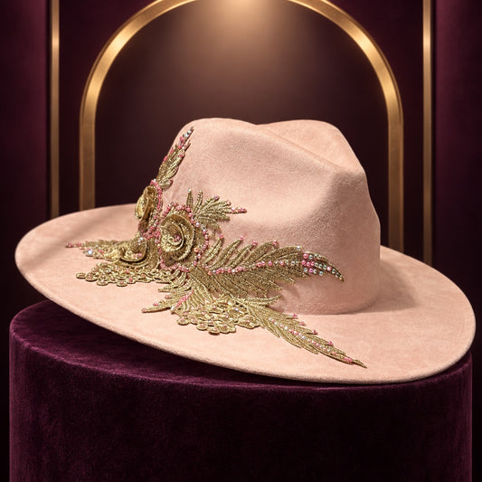 Blush pink wide-brim fedora with ornate gold floral applique and pink rhinestone accents